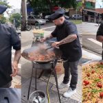 Personal chef que 'cozinha na rua' viraliza ao preparar macarronada em esquina movimentada de Maringá; vídeo